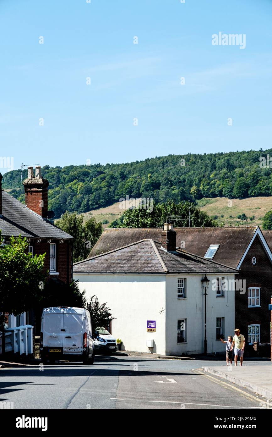 Dorking, Surrey Hills, London UK, July 07 2022, Housing In Rural Countryside With Hill And Forest Behind Under A Blue Sky Stock Photo