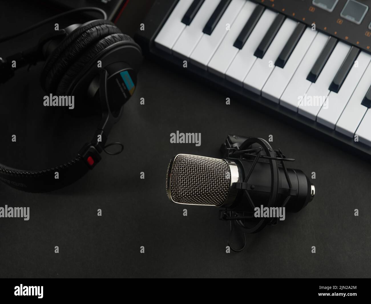 Professional studio equipment headphones, microphone and modern