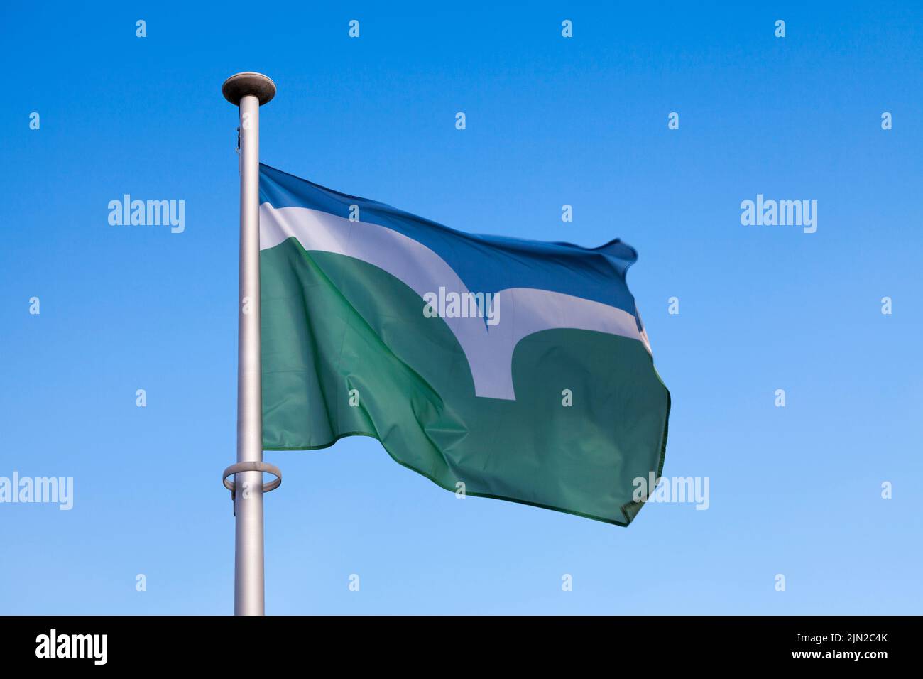 Close-up on the Flag of Côtes-d'Armor (Brittany - France) waving on top of a pole. Stock Photo