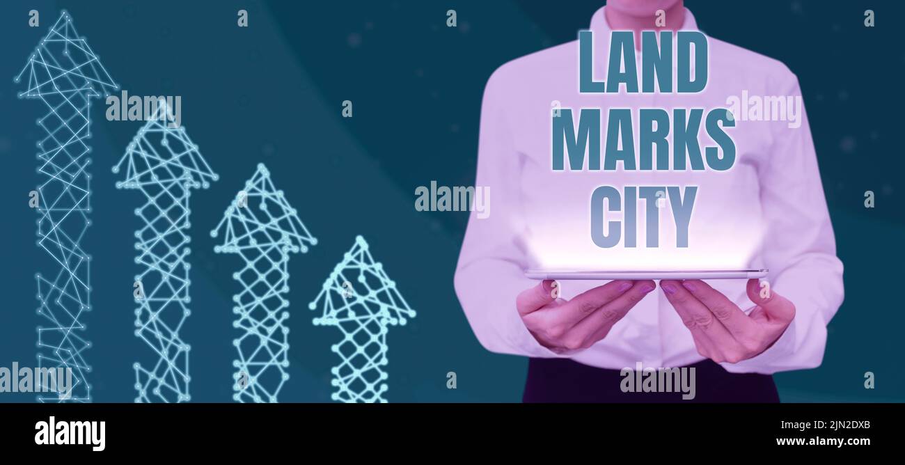 Writing displaying text Land Marks City. Concept meaning Important architecture places in the cities to visit Businesswoman Holding Tablet And Stock Photo