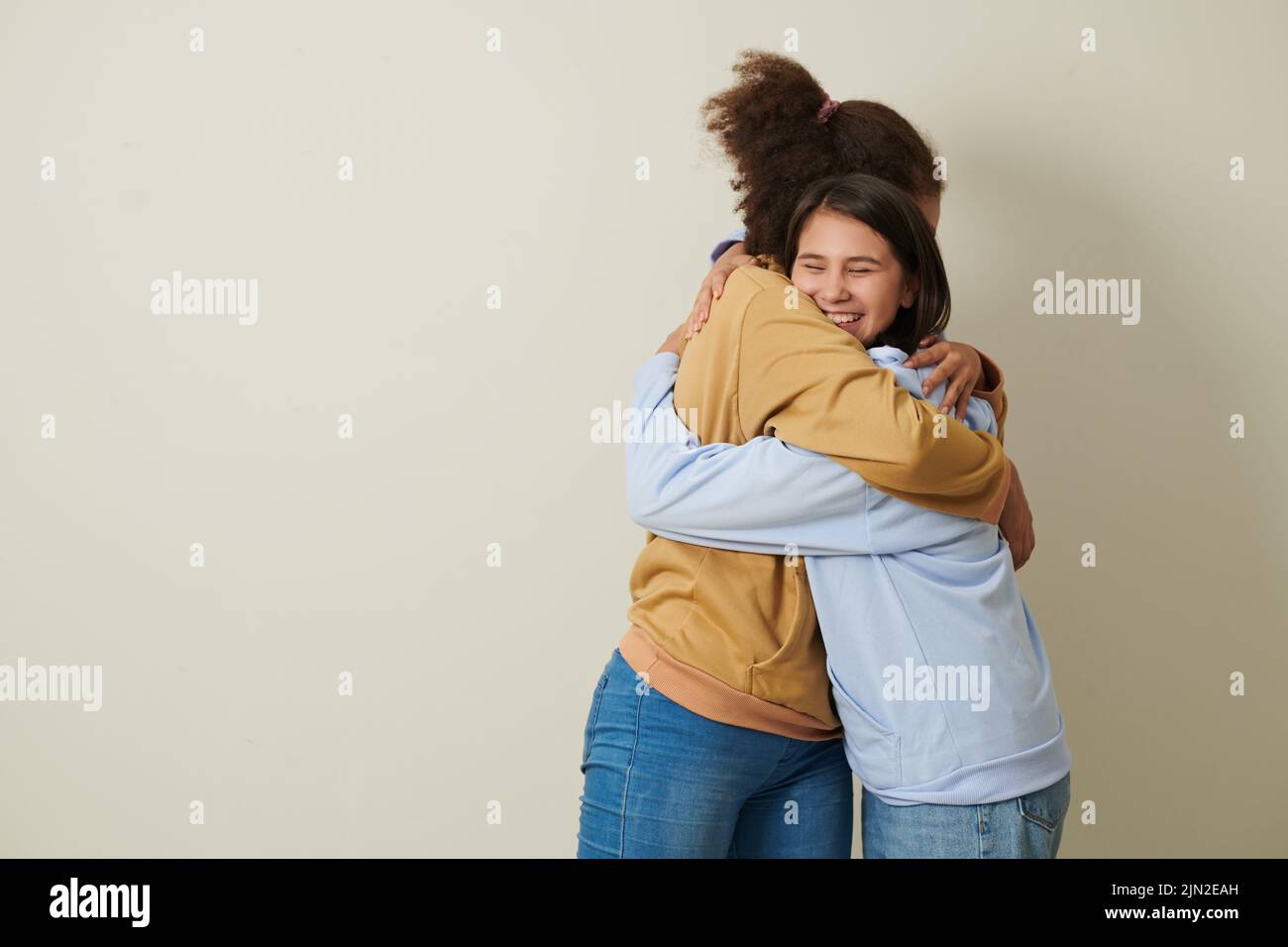 Happy teenage girls hugging other hi-res stock photography and images ...