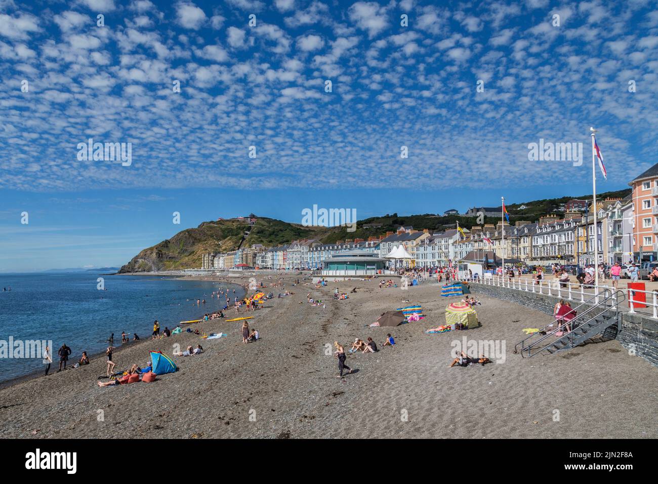 A view of the beach, promenade and Constitution Hill at the Welsh seaside town of Aberystwyth. Stock Photo
