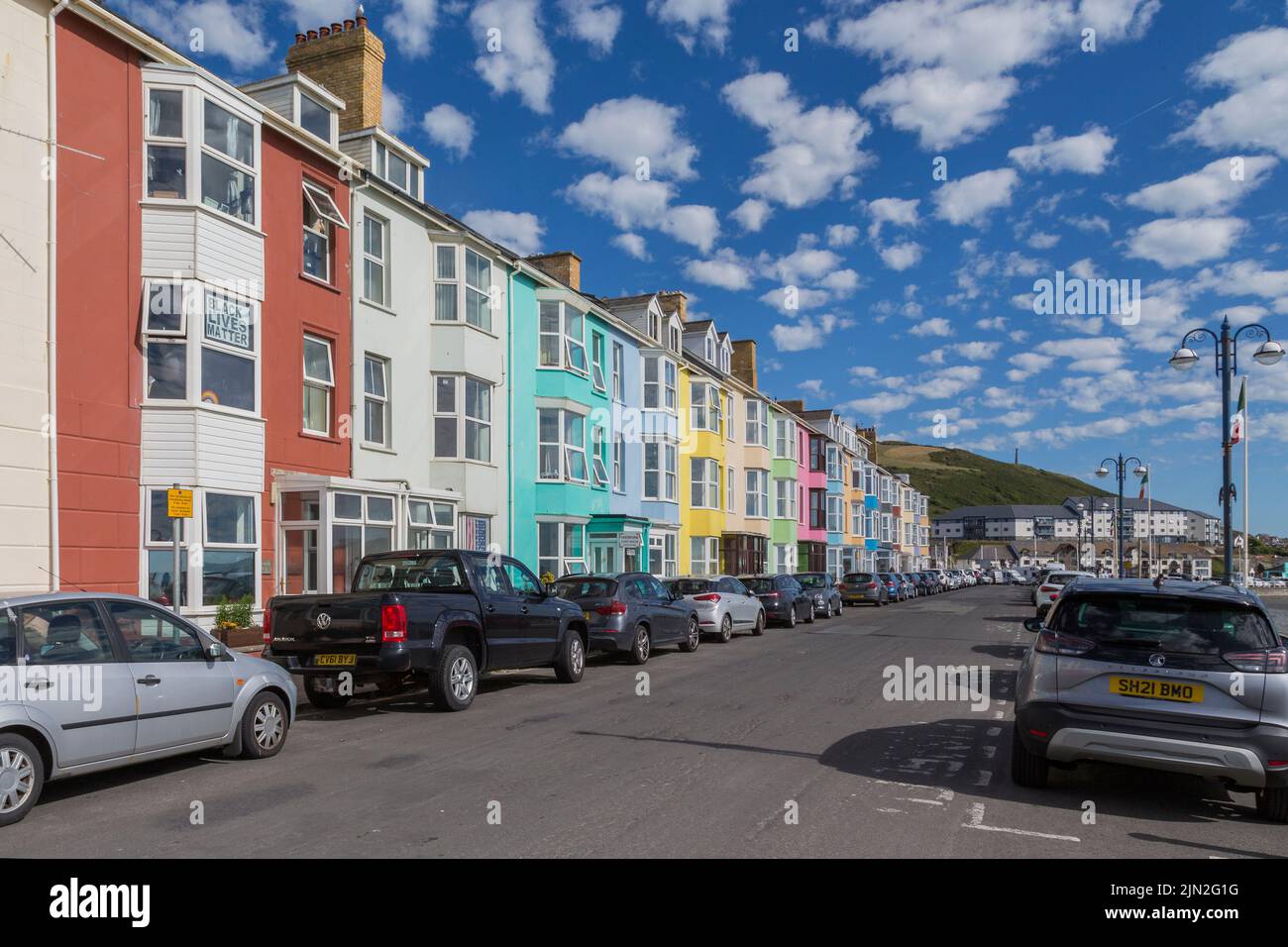 A row of colourful house line a street in the seaside town of Aberystwyth, Wales, United Kingdom. Stock Photo