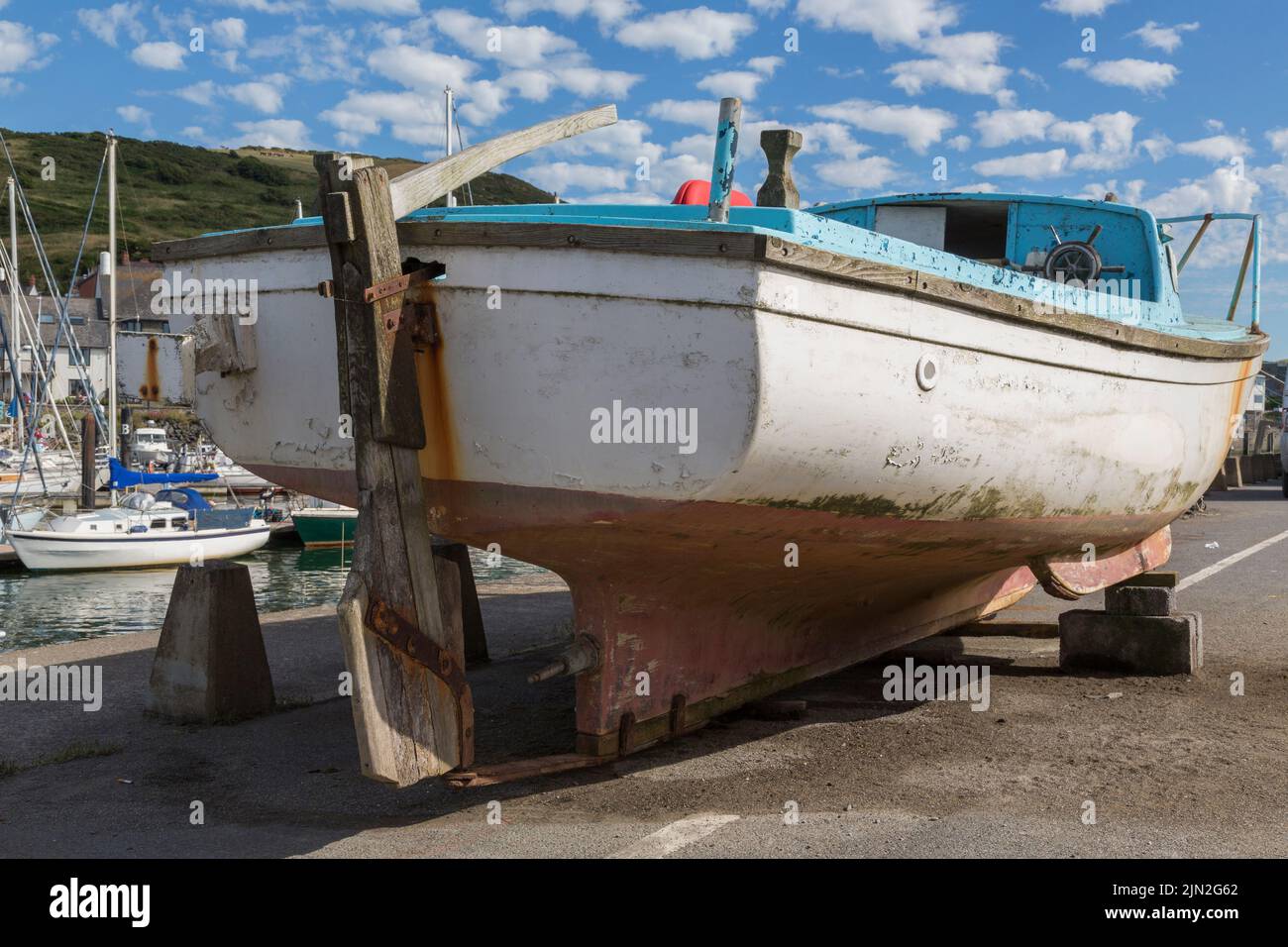 Detail of a small boat dry docked on a quayside. Stock Photo