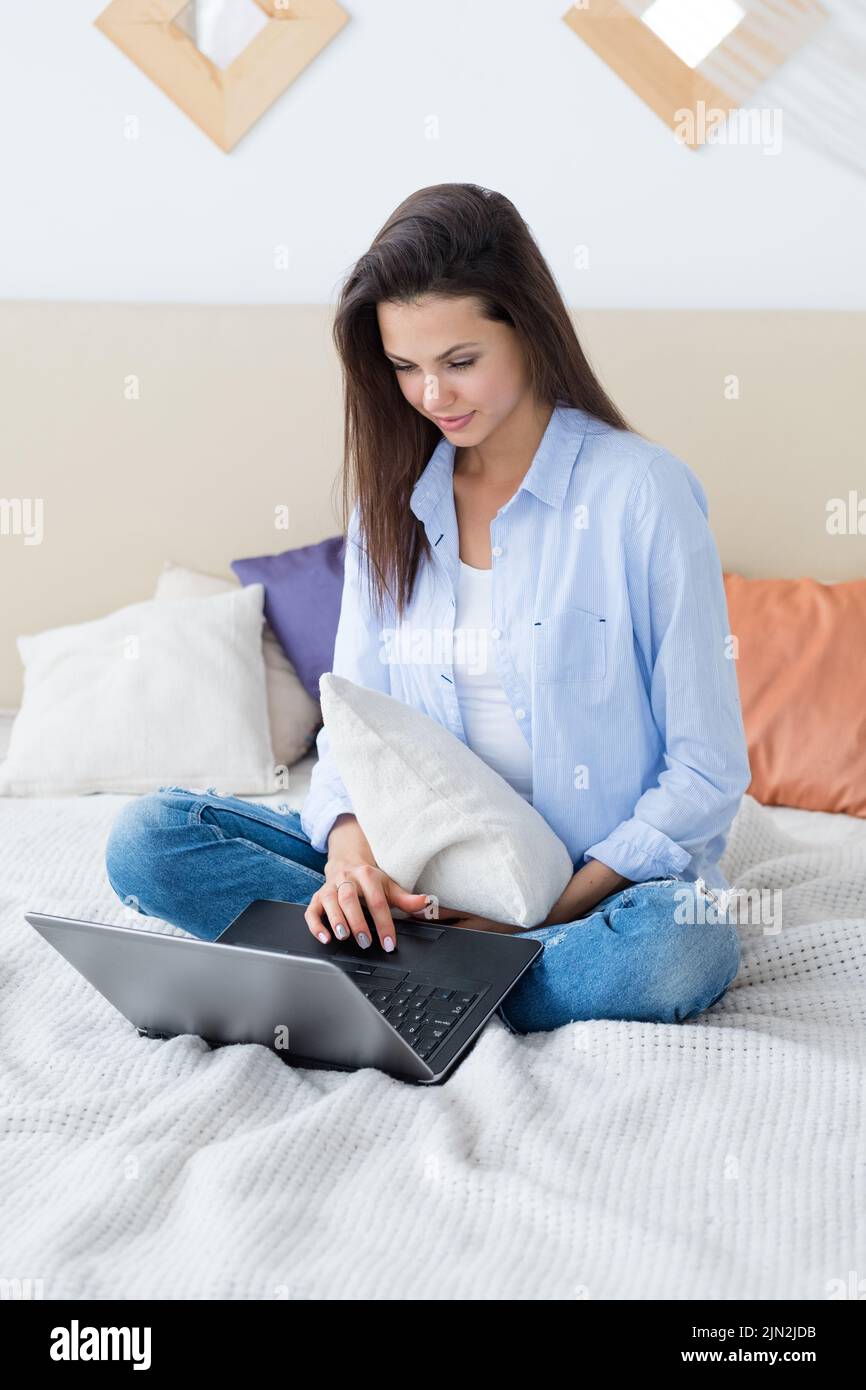 woman laptop sitting casual home leisure idleness Stock Photo