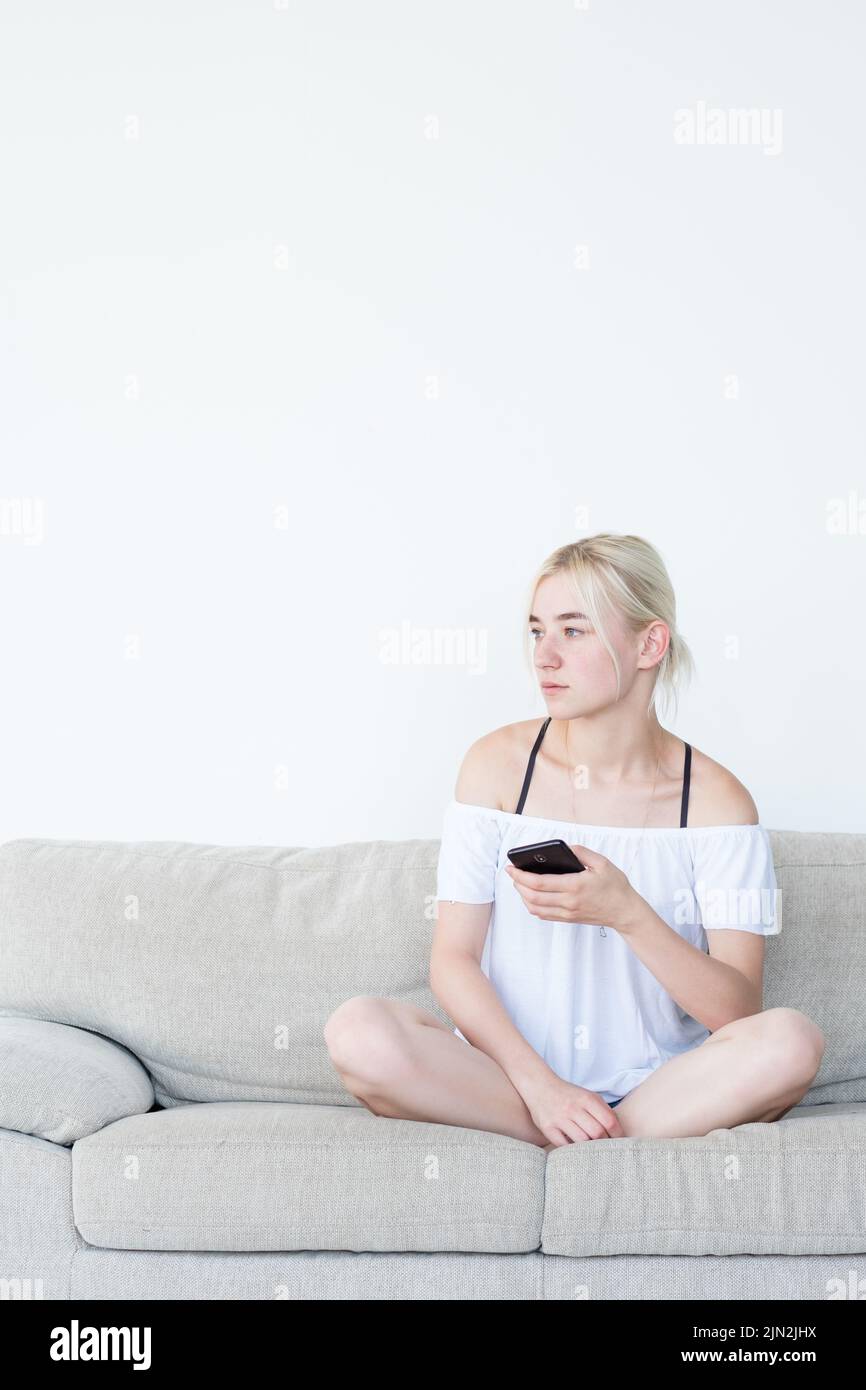 woman phone idle lifestyle home leisure network Stock Photo