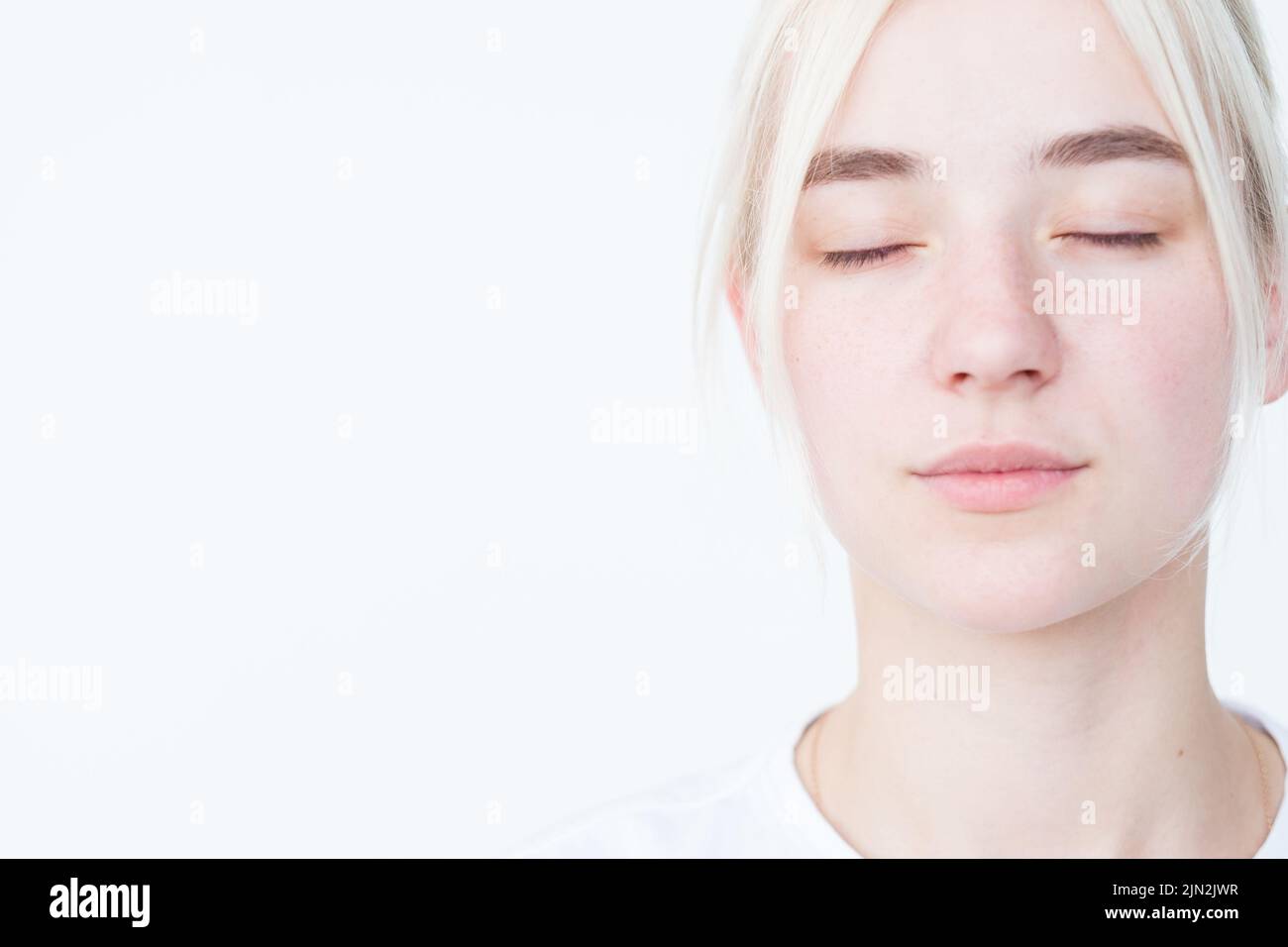 pensive mysterious woman eyes close portrait white Stock Photo - Alamy