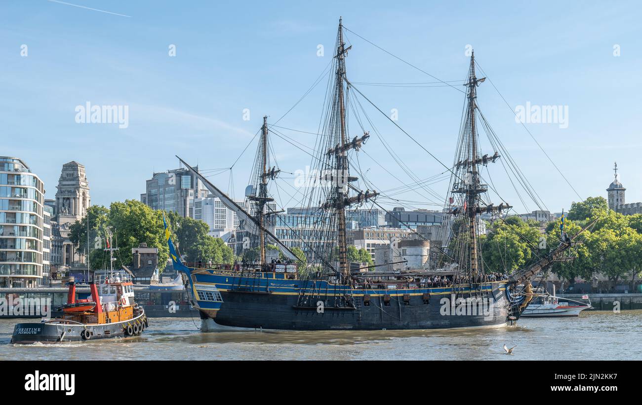 Swedish tall ship Gotheborg (Götheborg) being guided in to berth near the Tower of London by tug Christine, after passing through Tower Bridge. Stock Photo