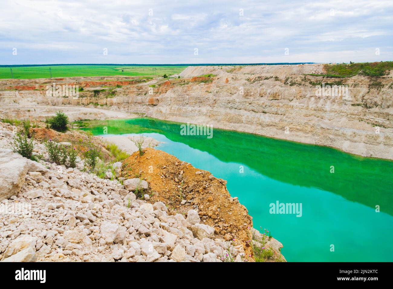 Lake formation in an old abandoned quarry. Quarry lake. Crushed stone