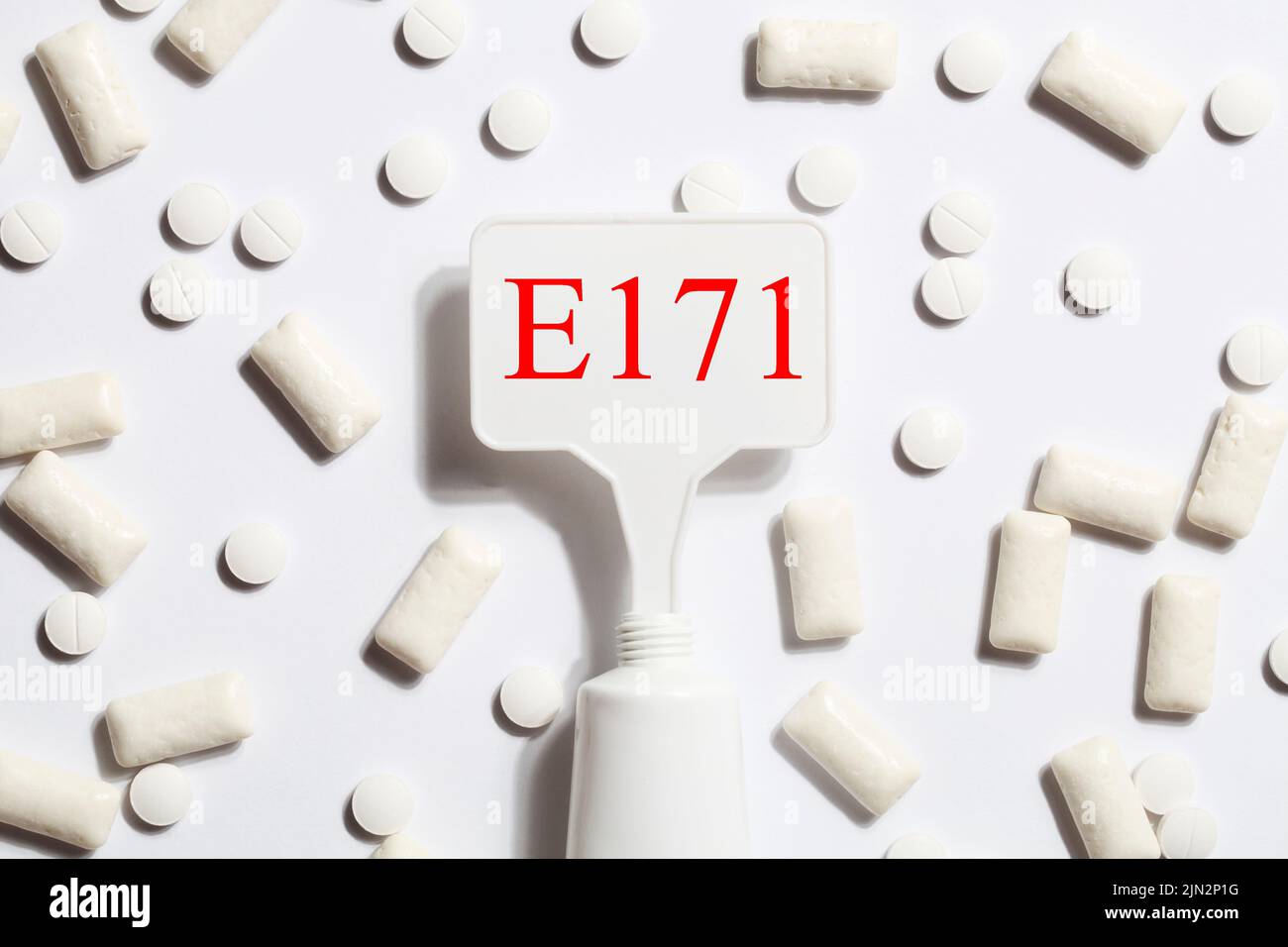 Titanium dioxide, E171, dangerous additive concept. gum, pills ...