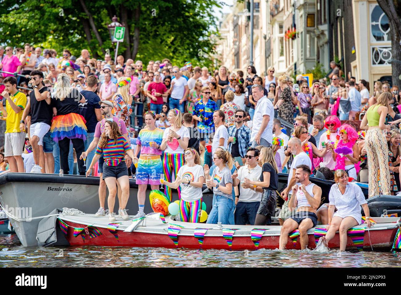People Enjoying The Canal Parade Through The Canals Of Amsterdam During Pride 2022 The Parade