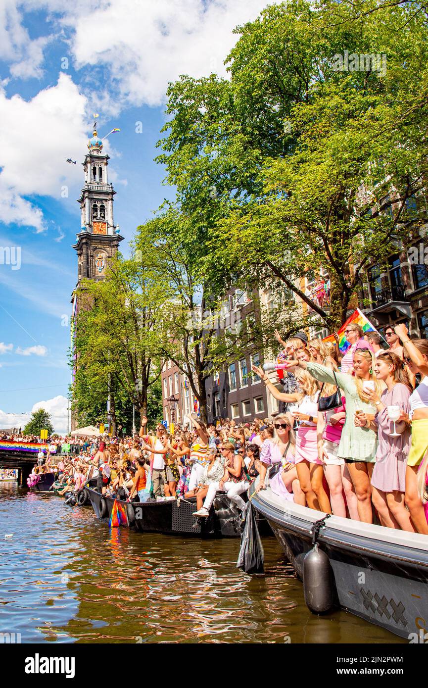 People Enjoying The Canal Parade Through The Canals Of Amsterdam During Pride 2022 The Parade