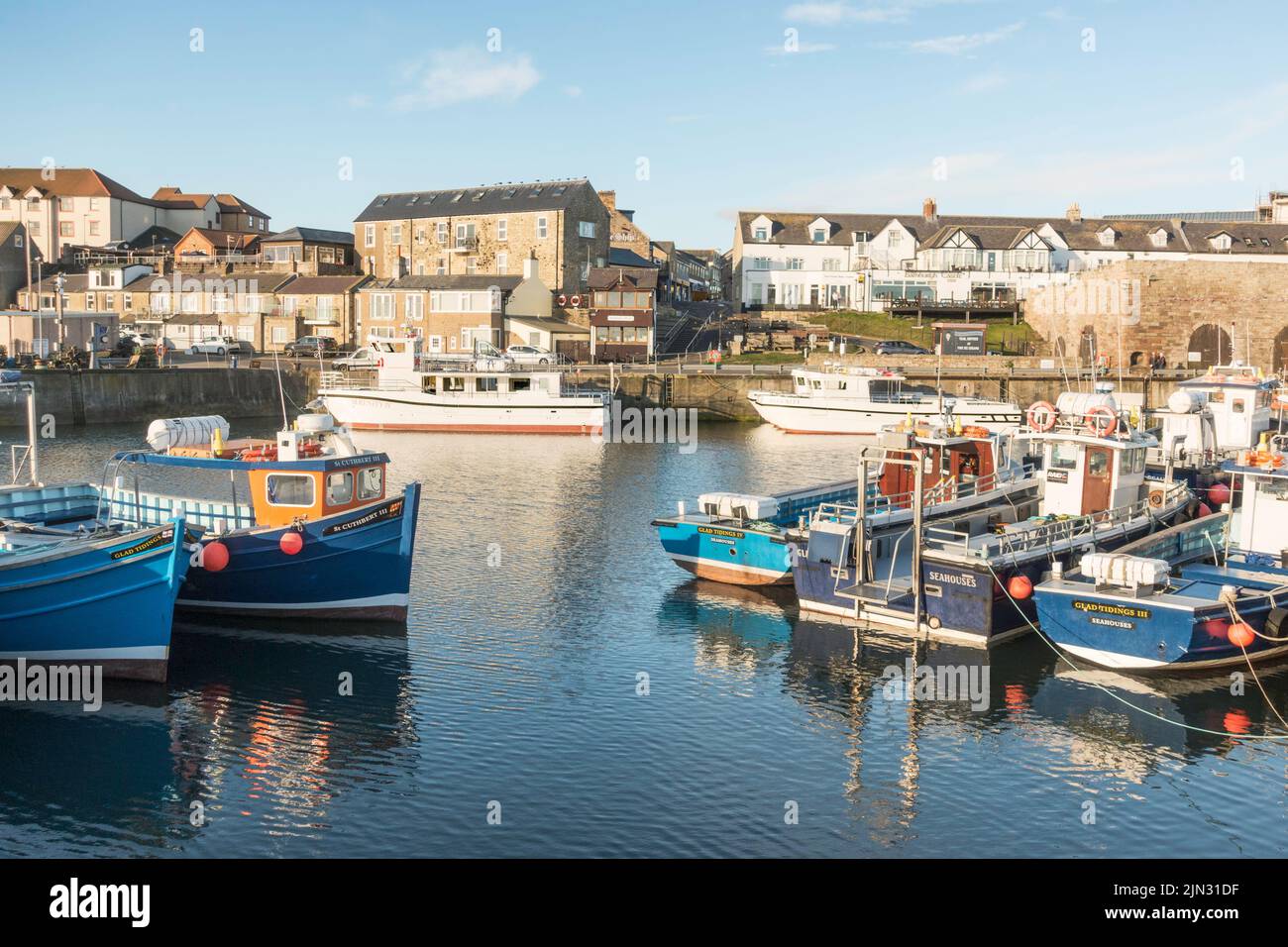 Boats moored in North Sunderland harbour, Seahouses, Northumberland, England, UK Stock Photo