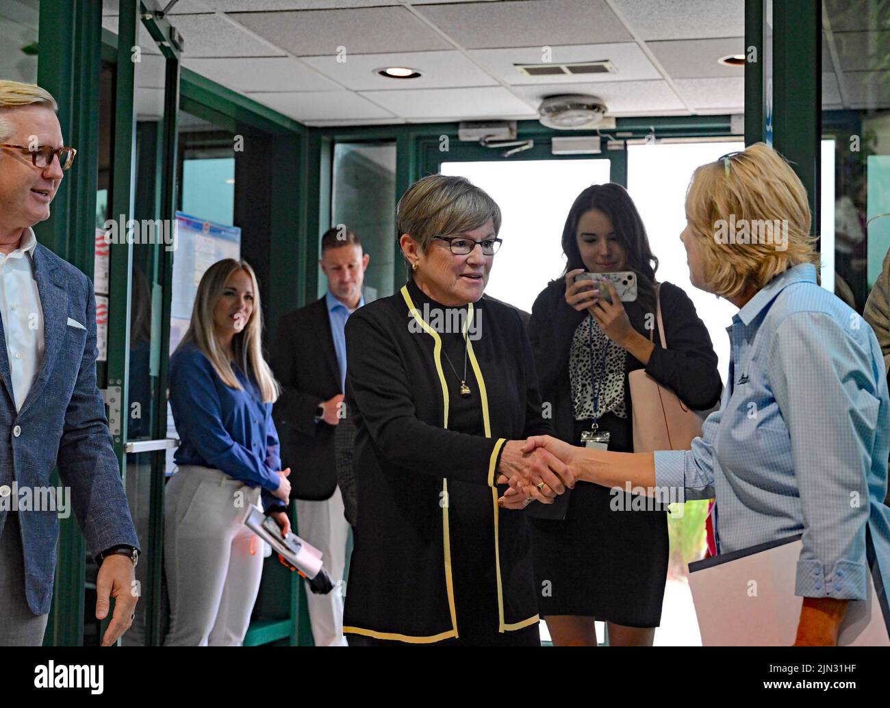 EMPORIA, KANSAS - AUGUST 8, 2022 Kansas Governor Laura Kelly arrives at the Simmons Pet food plant shakes hands with Julie Maus the Director Of Communications for Simmons during her Prosperity on the Plains Tour stop in Emporia today Stock Photo