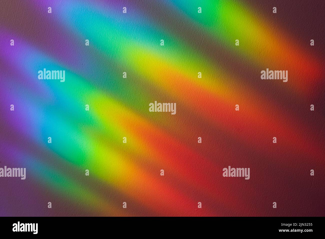 Beautiful spectral gradient of sunlight on the wall. Stock Photo