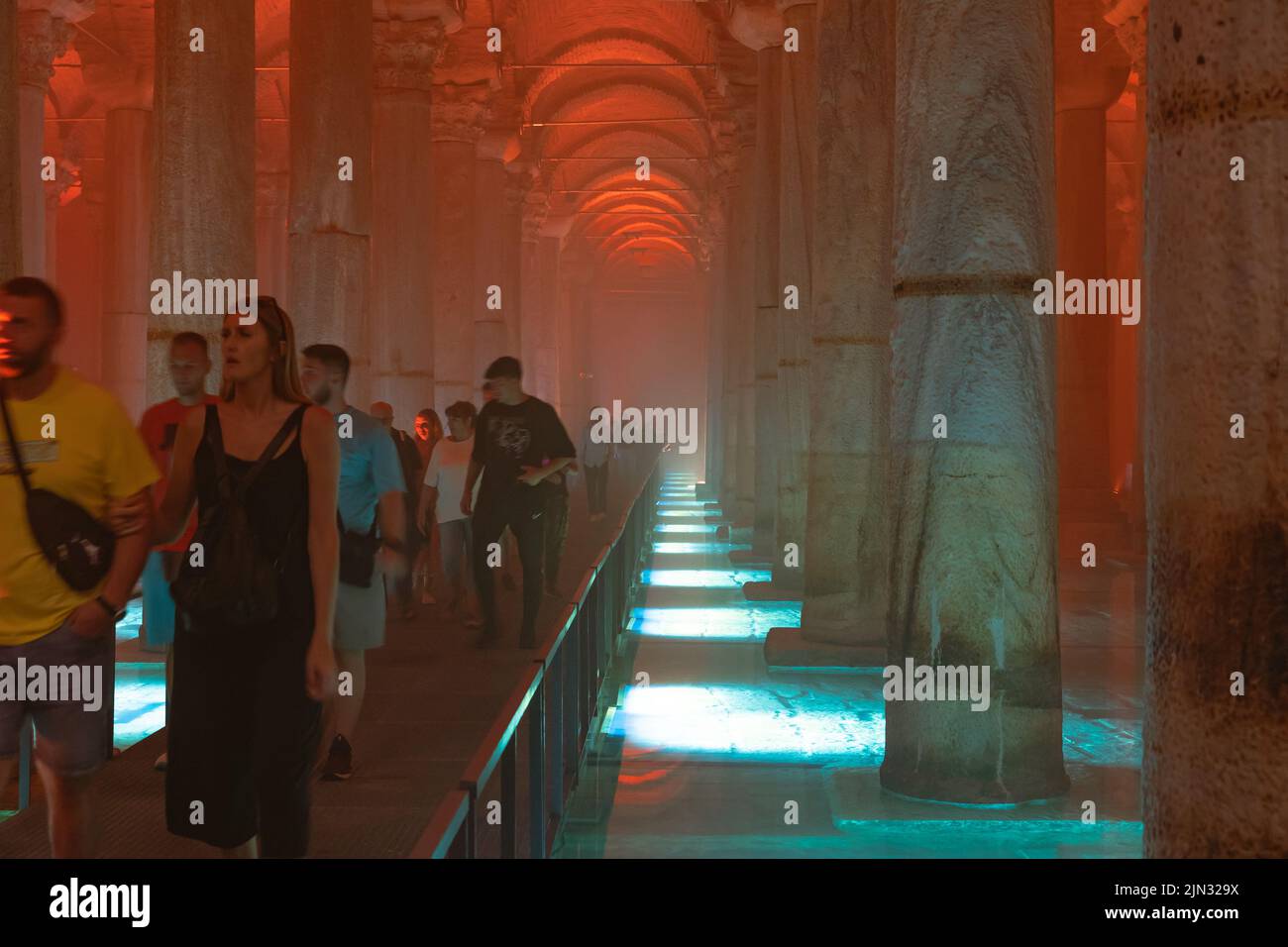 Basilica Cistern and tourists. People in Basilica Cistern or Yerebatan Sarnici. Noise and grain included. Selective focus. Istanbul Turkey - 8.3.2022 Stock Photo
