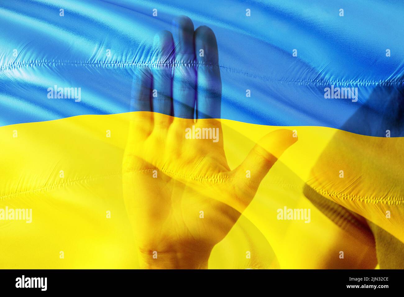 The flag of Ukraine is yellow-blue and the hand of a woman, Stop war and patriotism, peace in Ukraine Stock Photo