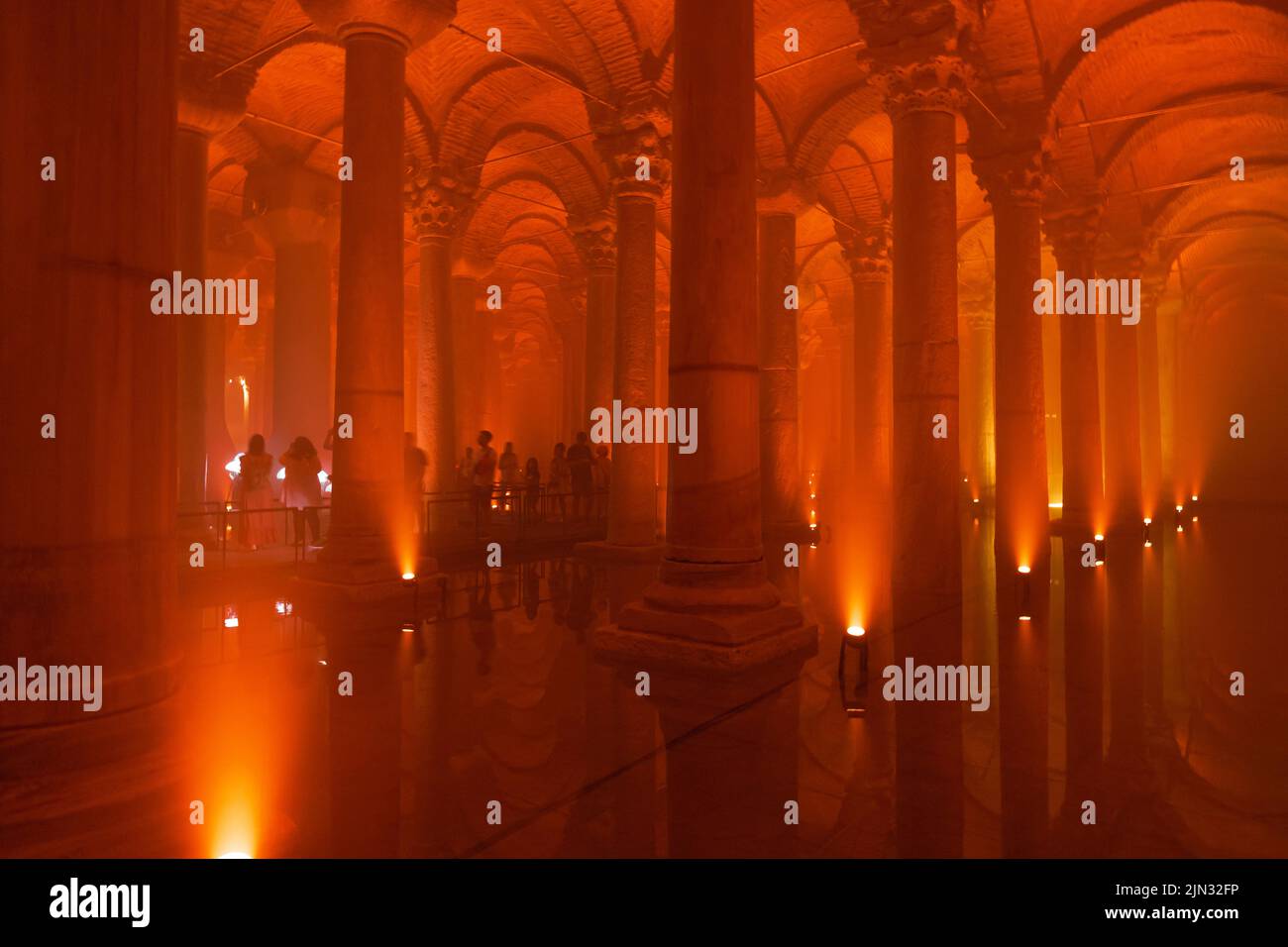 The Basilica Cistern with orange light ambient. Tourism in Istanbul background photo. Noise and grain included. Selective focus. Istanbul Turkey - 8.3 Stock Photo