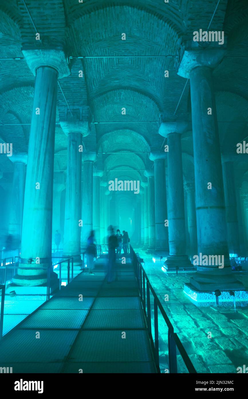 The Basilica Cistern with turquoise light ambient. Landmarks of Istanbul vertical story background photo. Noise and grain included. Selective focus. I Stock Photo