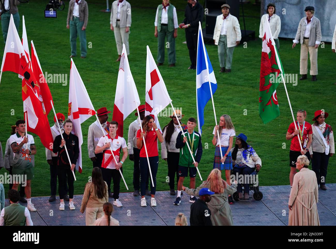 Flagbearers, including Jersey's Daniel Lee, Northern Ireland's Dylan Eagleson and Scotland's Eilish McColgan, during the Closing Ceremony for the 2022 Commonwealth Games at the Alexander Stadium in Birmingham. Picture date: Monday August 8, 2022. Stock Photo