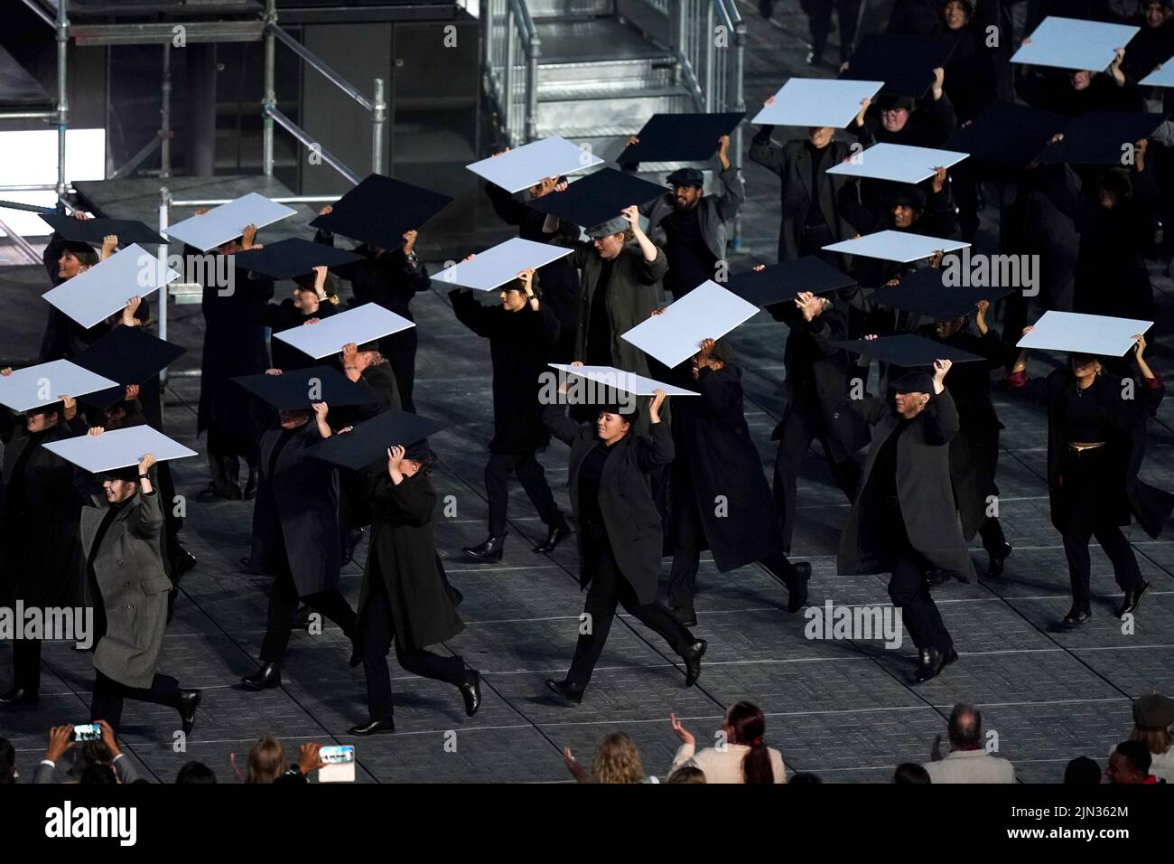 Performers take the stage for a Peaky Blinders themed segment during the Closing Ceremony for the 2022 Commonwealth Games at the Alexander Stadium in Birmingham. Picture date: Monday August 8, 2022. Stock Photo