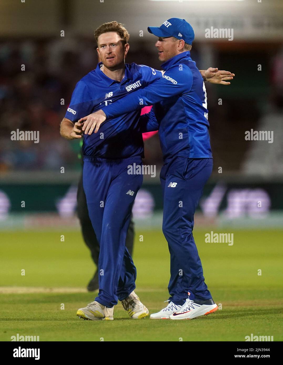 London Spirit's Liam Dawson (left) and Eoin Morgan celebrate a wicket during The Hundred match at Lord's, London. Picture date: Monday August 8, 2022. Stock Photo