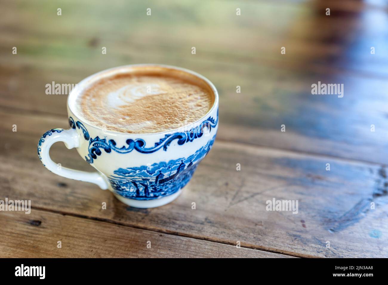 cup of coffee on the wooden table Stock Photo