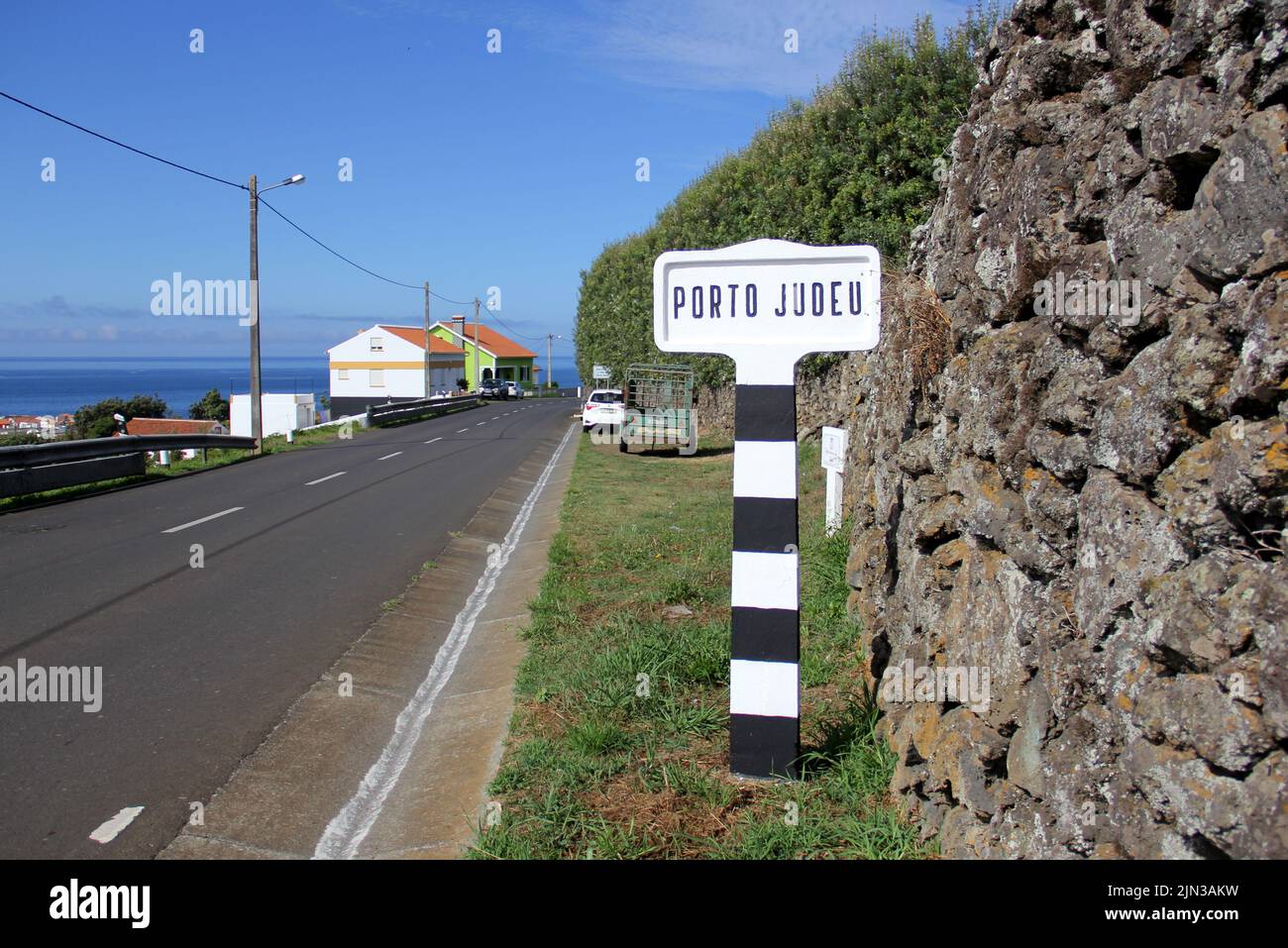 Road sign at the entrance to the town of Porto Judeu, Terceira, Azores ...