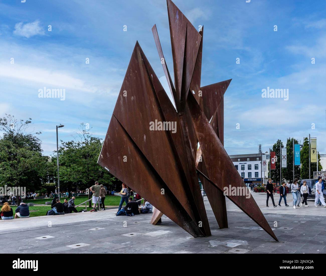 Éamonn O’Doherty’s sculpture of a Galway Hooker traditional fishing boat, set on a flat flagged limestone fountain  in Eyre Square, Galway, Ireland. Stock Photo