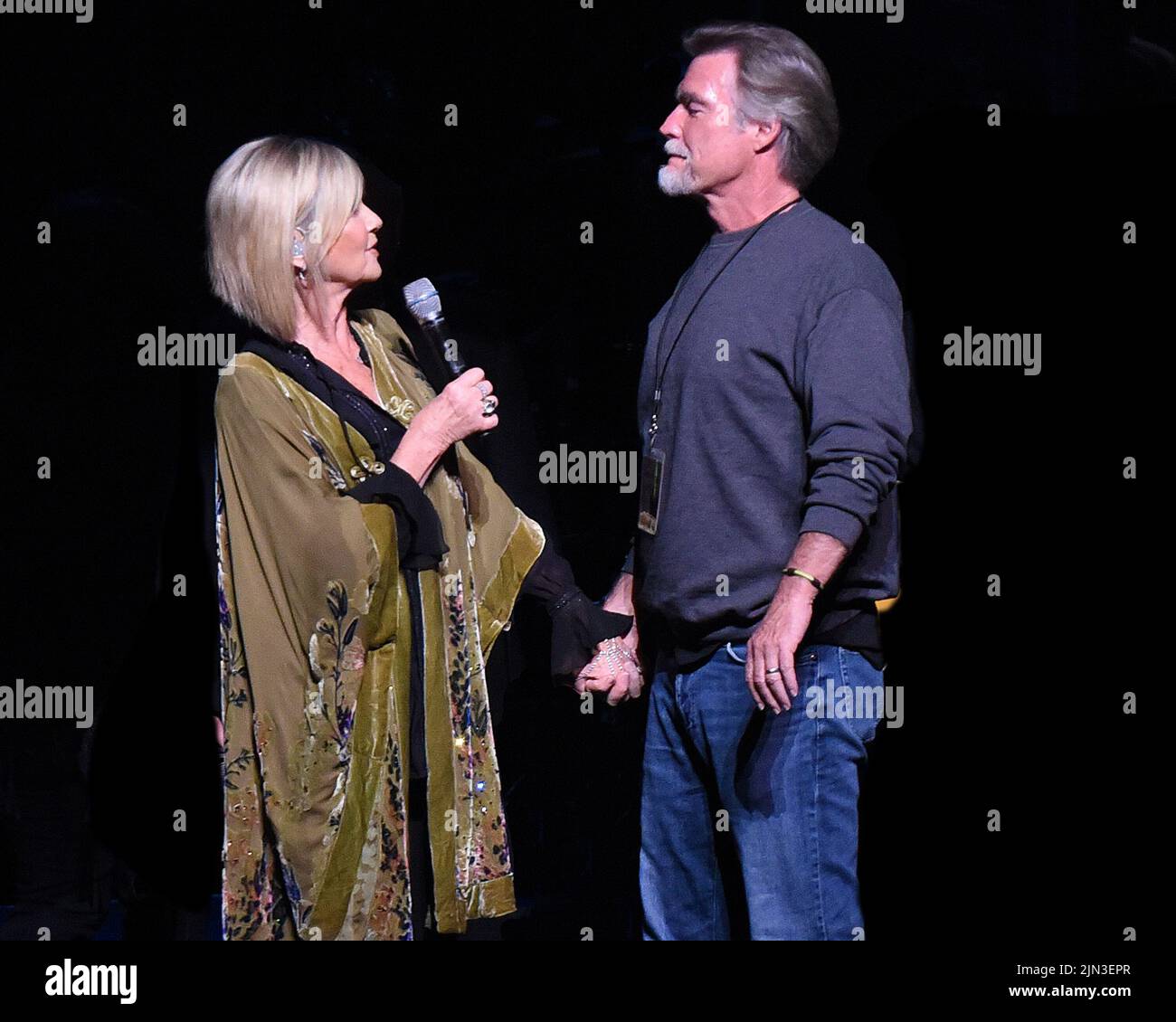 FILE PICS: Olivia Newton-John 1948-2022. Atlanta, GA, USA. 9th Apr, 2017. Olivia Newton-John surprises her husband John Easterling by singing a parody of “The Girl From Ipanema” as “The Boy From North Carolina” (in his honor) which she had sung for him at their wedding. The surprise performance took place at Cobb Energy Center in Atlanta, Georgia on April 9, 2017. Credit: Chris Mc Kay/Media Punch/Alamy Live News Credit: MediaPunch Inc/Alamy Live News Stock Photo