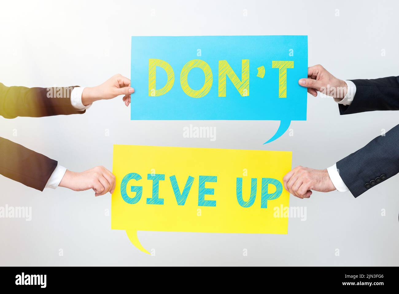 Writing displaying text Don T Not Give Up, Word for Determined Persevering Continue to Believe in Yourself Business Team Holding Two Important Ideas O Stock Photo