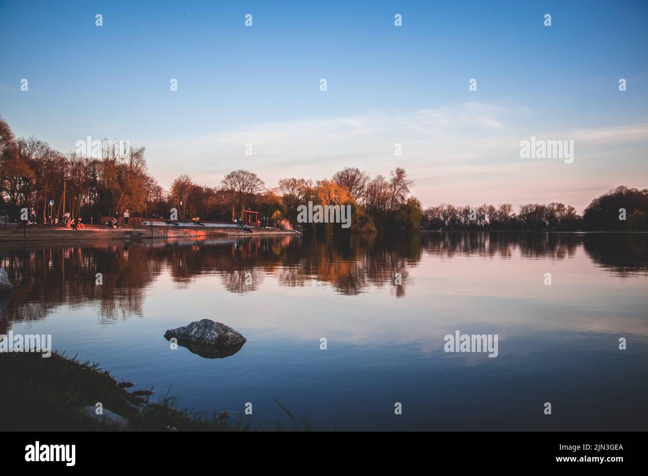 An autumn trees with reflection in a lake under cloudy sky Stock Photo ...