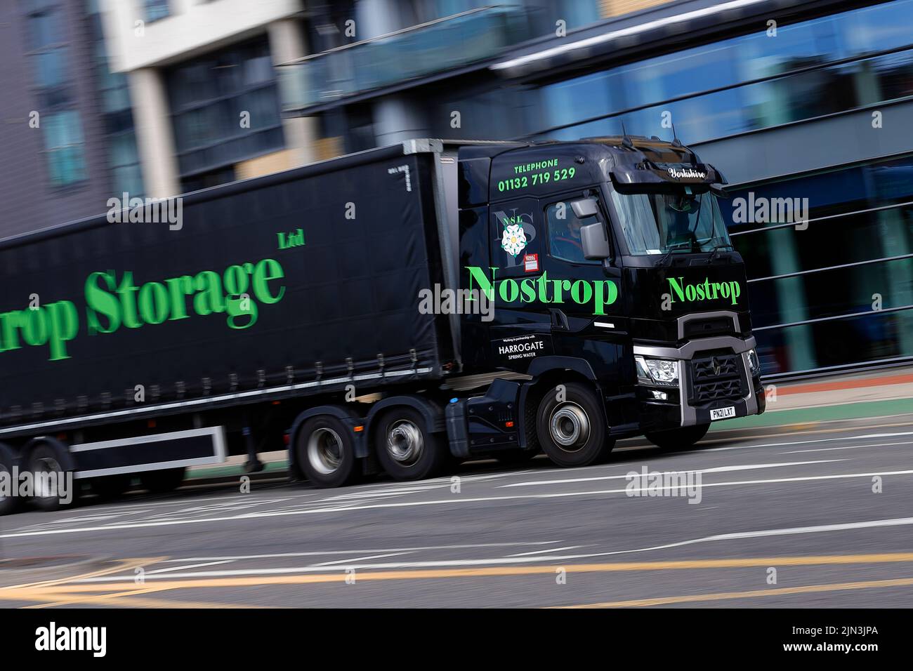 A Nostrop Storage articulated lorry seen driving though Leeds City Centre Stock Photo