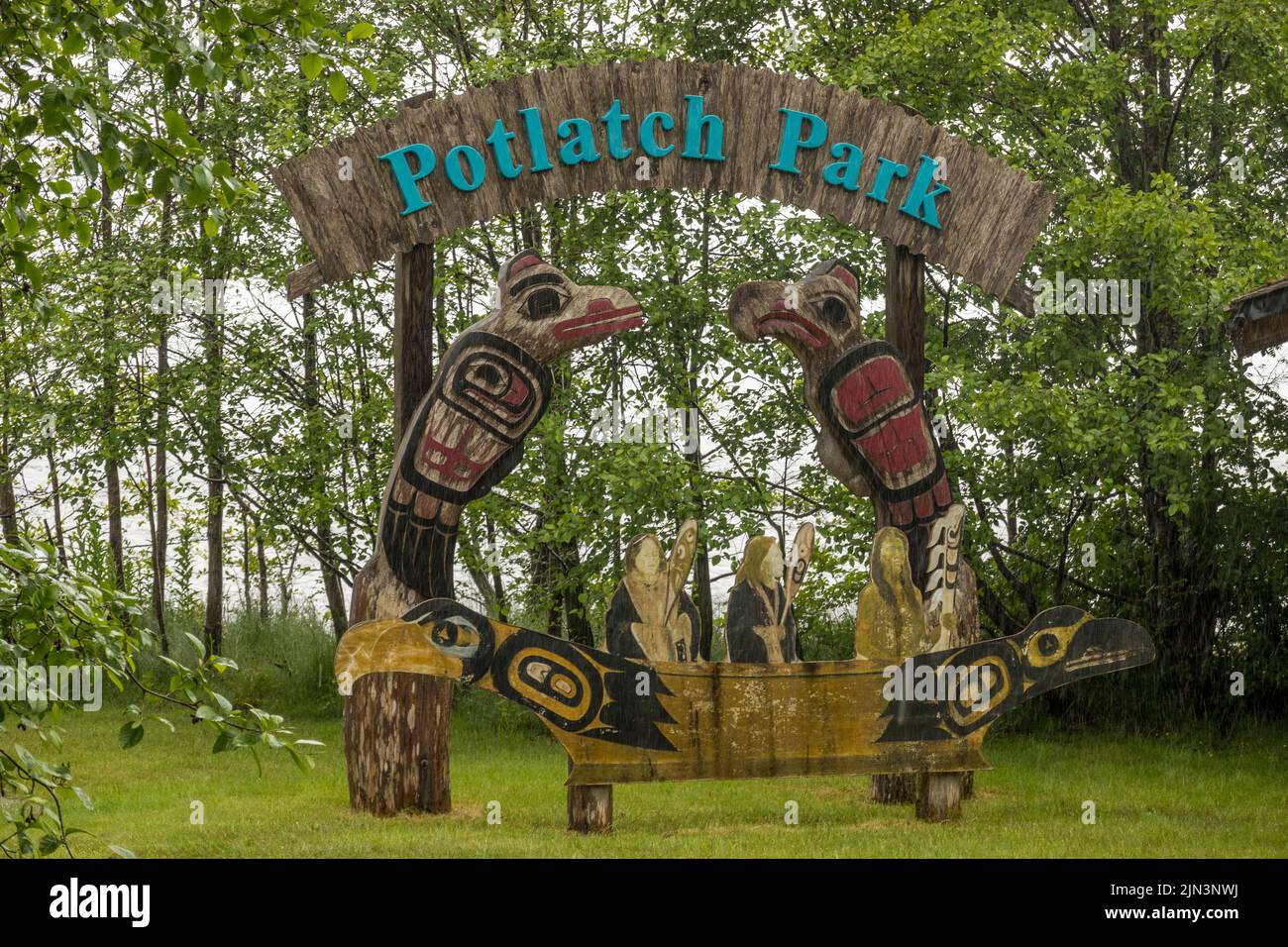 Ketchikan, AK - 10 June 2022: Totem poles and welcome sign in Potlatch Park in Ketchikan Alaska Stock Photo