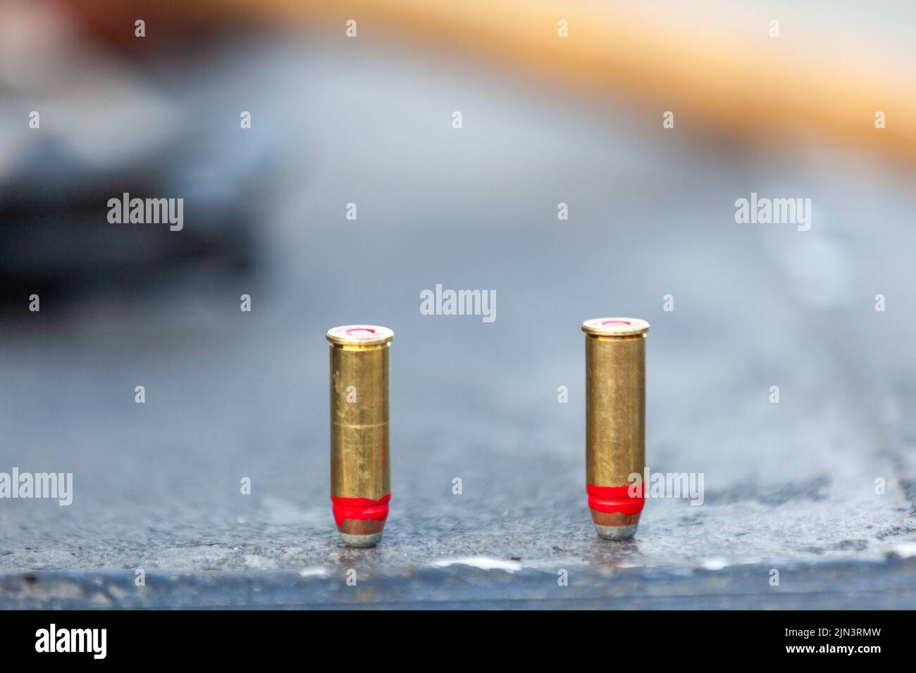 A line of red nail polish dries on a bullet to help waterproof the ammo to use in a bang-stick during a nighttime alligator hunting expedition in Bowman, South Carolina. Alligator hunting in South Carolina is limited by lottery and a four week season once a year. Stock Photo