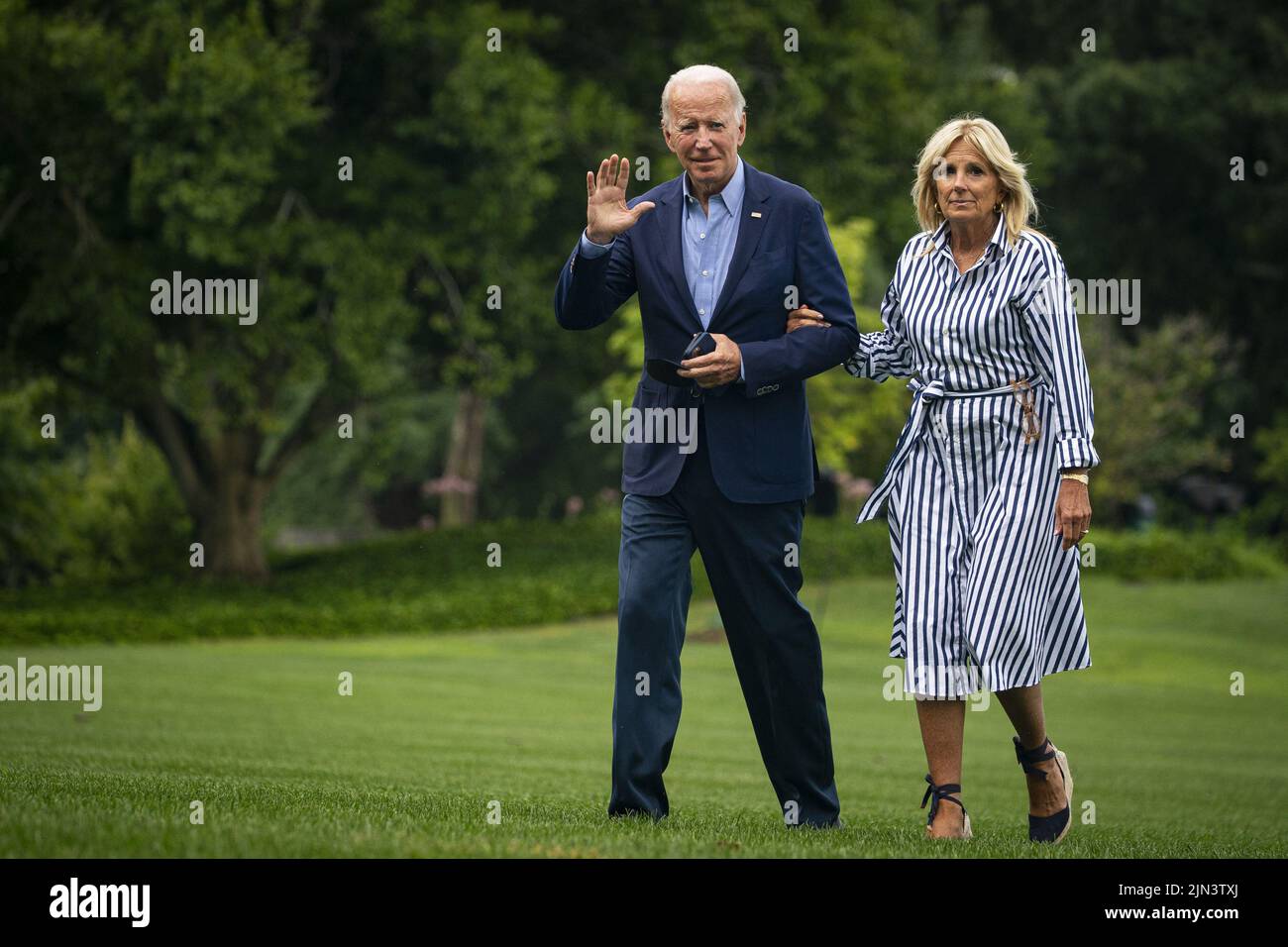 Washington, United States. 08th Aug, 2022. U.S. President Joe Biden and First Lady Jill Biden walk on the South Lawn of the White House after arriving on Marine One in Washington, DC on Monday, August 8, 2022. Biden resumed official travel today for the first time since his bout with Covid-19, traveling to Kentucky to show federal support for the state's recovery from historic flooding and to console survivors of the devastation. Photo by Al Drago/UPI Credit: UPI/Alamy Live News Stock Photo