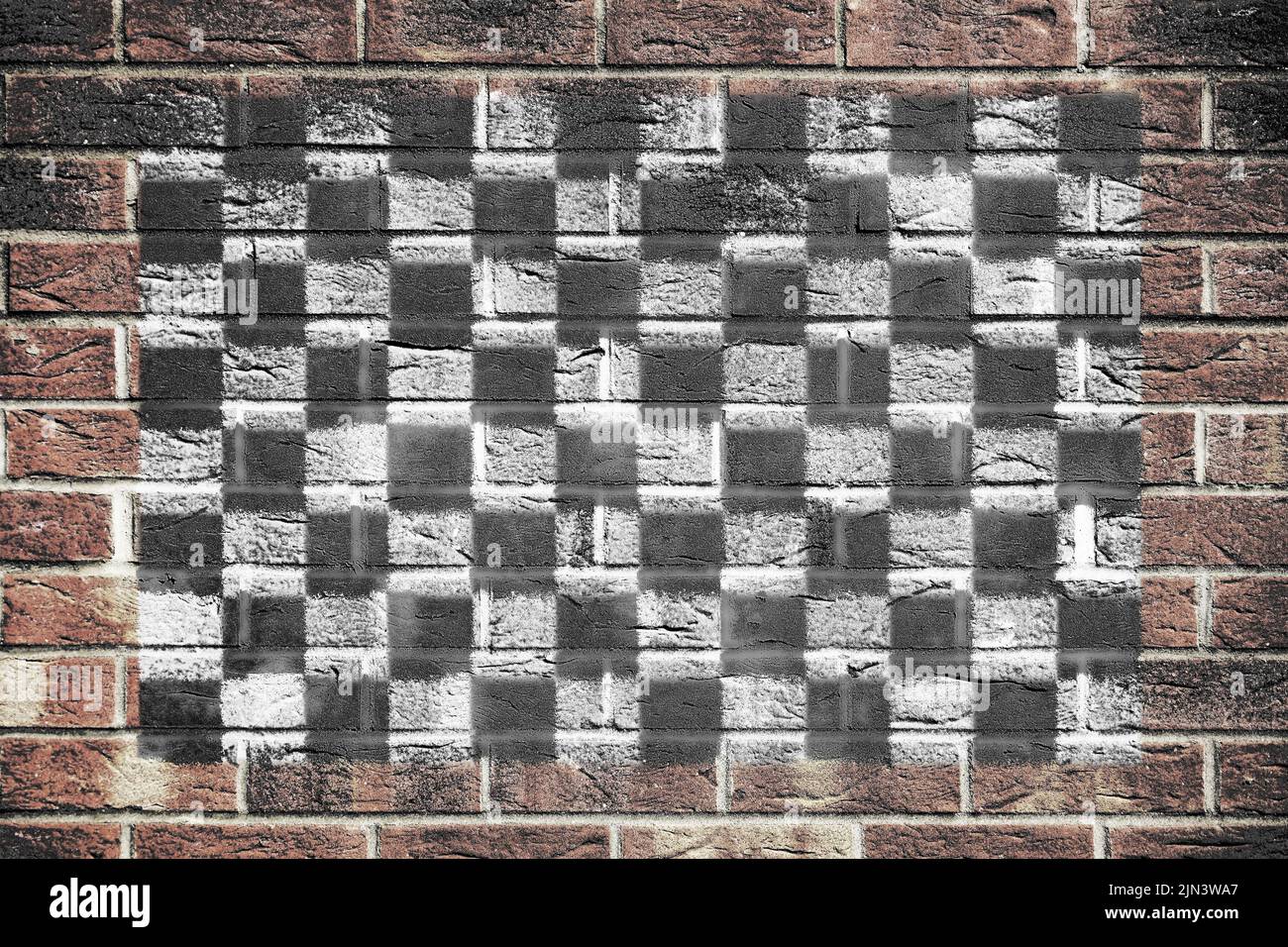 Motor racing chequered flag on brick wall background Stock Photo - Alamy