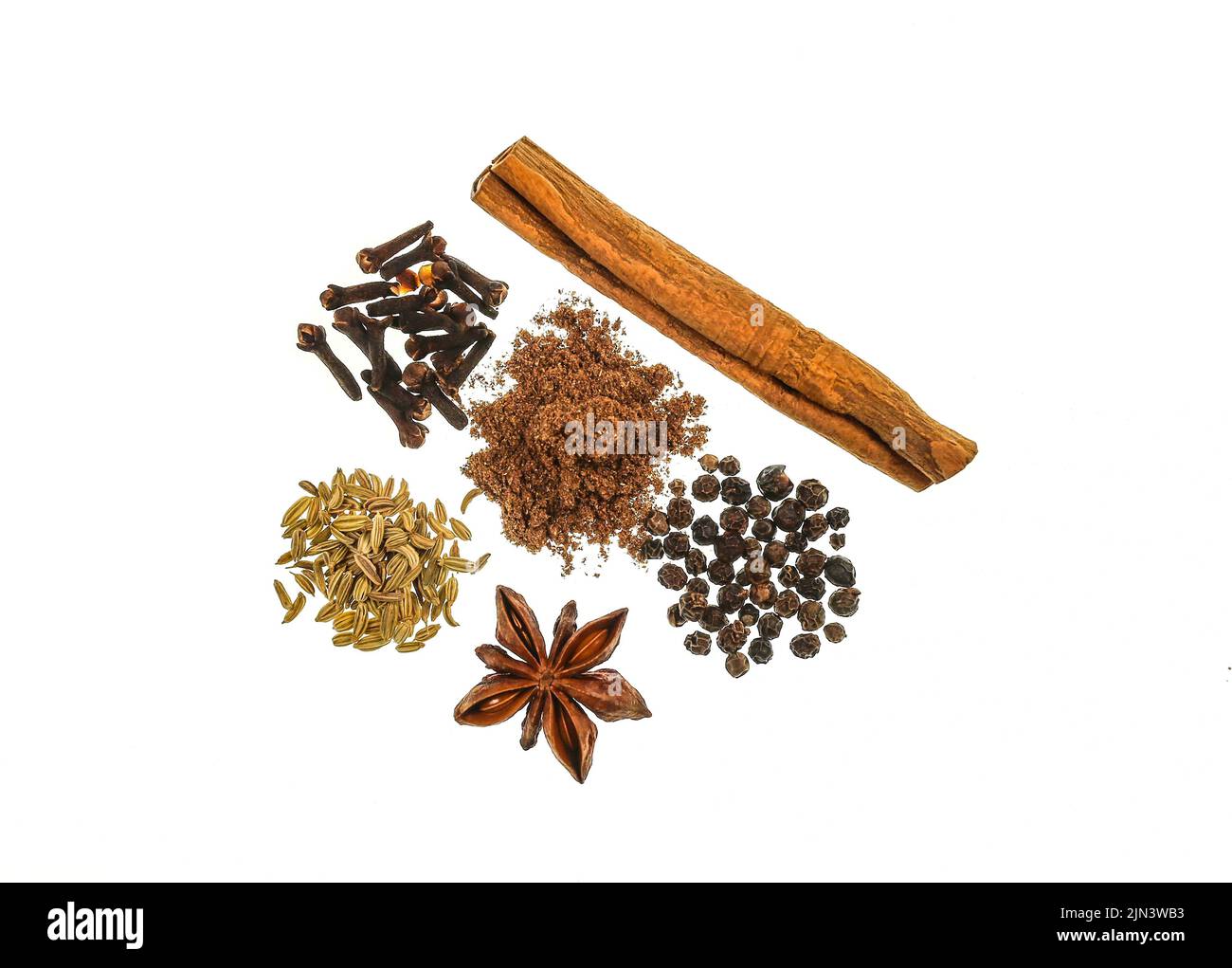 Chinese Five Spice Powder is a blend of five ingredients such as Star Anise, Fennel Seeds, Szechuan Peppercorns, Cloves and Cinnamon Stick Stock Photo