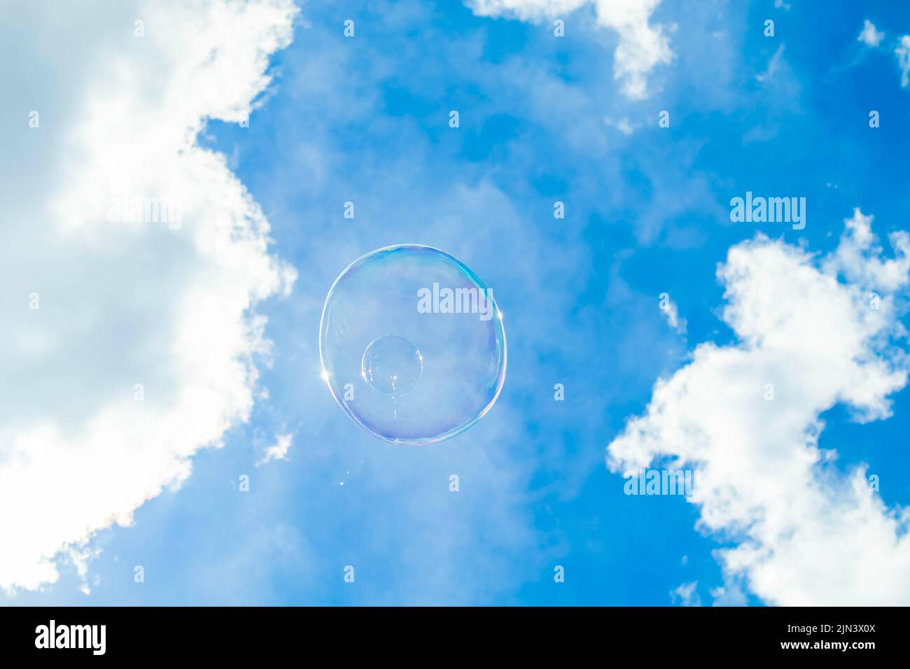Soap bubble with the reflection of buildings inside Stock Photo