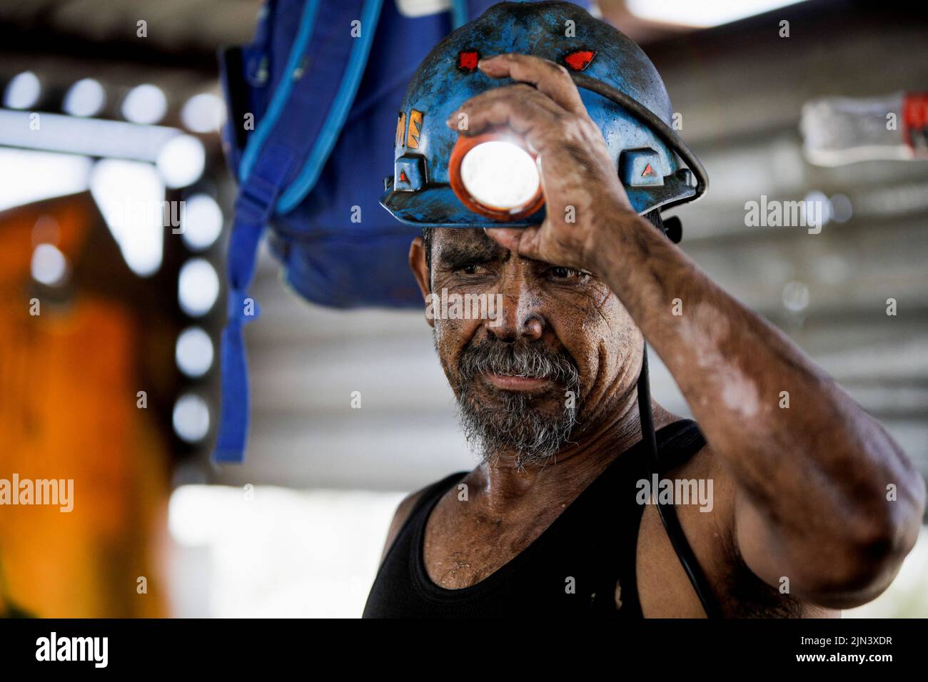 A miner works at an artisanal coal mine, or 'pocito' (little hole), known for their rudimentary and often dangerous mining techniques, in Sabinas, Coahuila state, Mexico, August 8, 2022. REUTERS/Luis Cortes Stock Photo