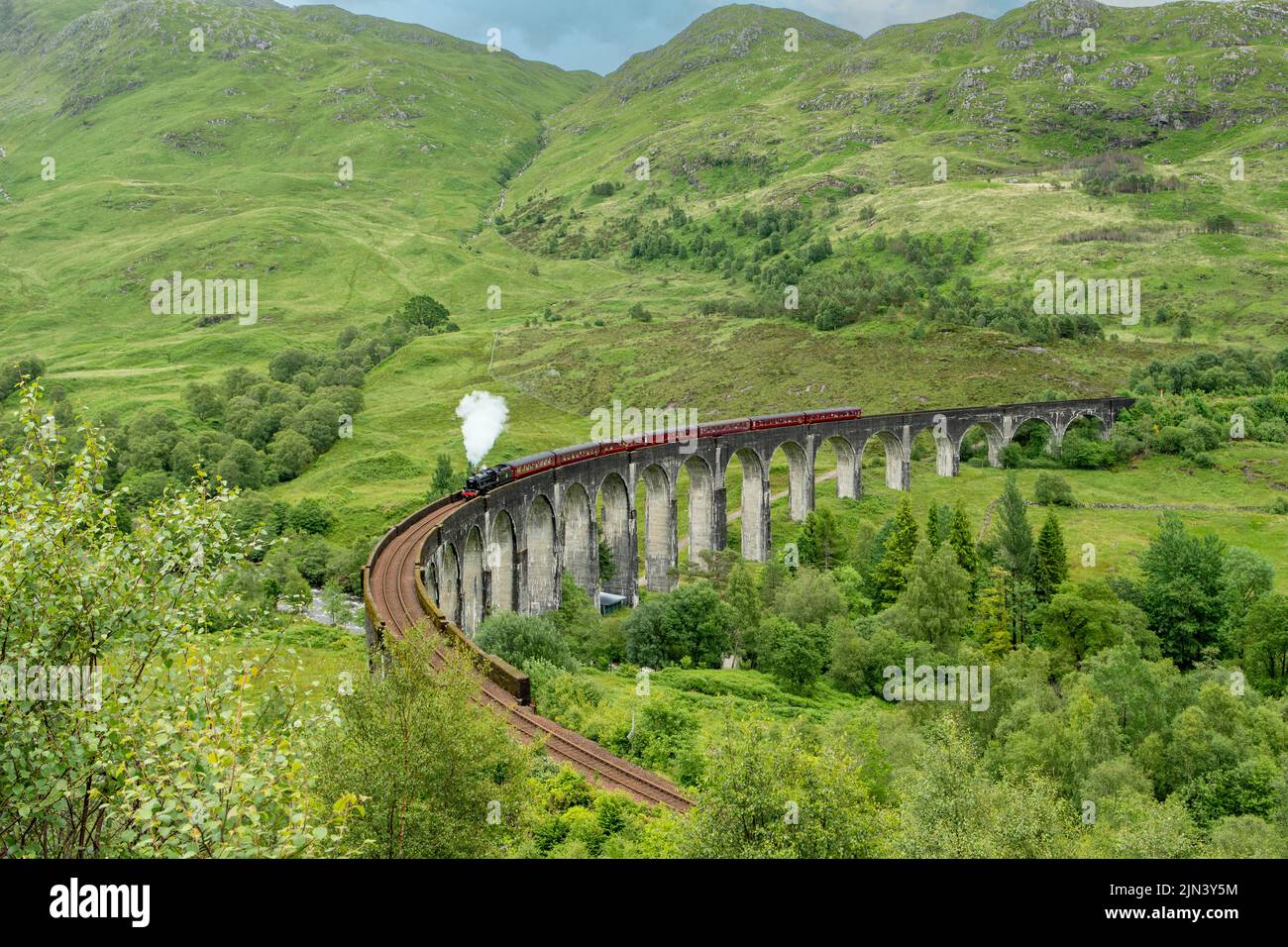 Steam Train on Viaduct at Glenfinnan, Highland, Scotland Stock Photo