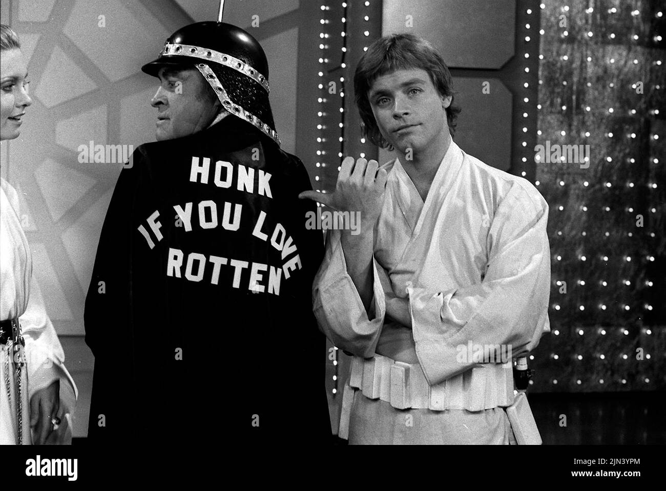 December 19, 1977, Hollywood, California, USA: (L-R) Actors OLIVIA NEWTON JOHN, BOB HOPE and MARK HAMILL do a spoof on ''STAR WARS'' during the NBC Bob Hope 1977 Christmas Special. (Credit Image: © Courtesy NBC/Globe Photos/ZUMA Wire) Stock Photo