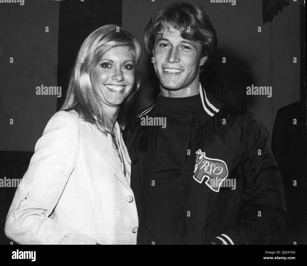 Circa 1979: ANDY GIBB of the Bee Gees with British Australian singer OLIVIA NEWTON JOHN. Released in 1980, the duet was called 'I Can't Help It' and appeared alongside their 1979 duet 'Rest Your Love On Me' as the sixth and seventh tracks on Andy's album 'After Dark,' when the two stars sang together. (Credit Image: © Globe Photos/ZUMA Wire) Stock Photo
