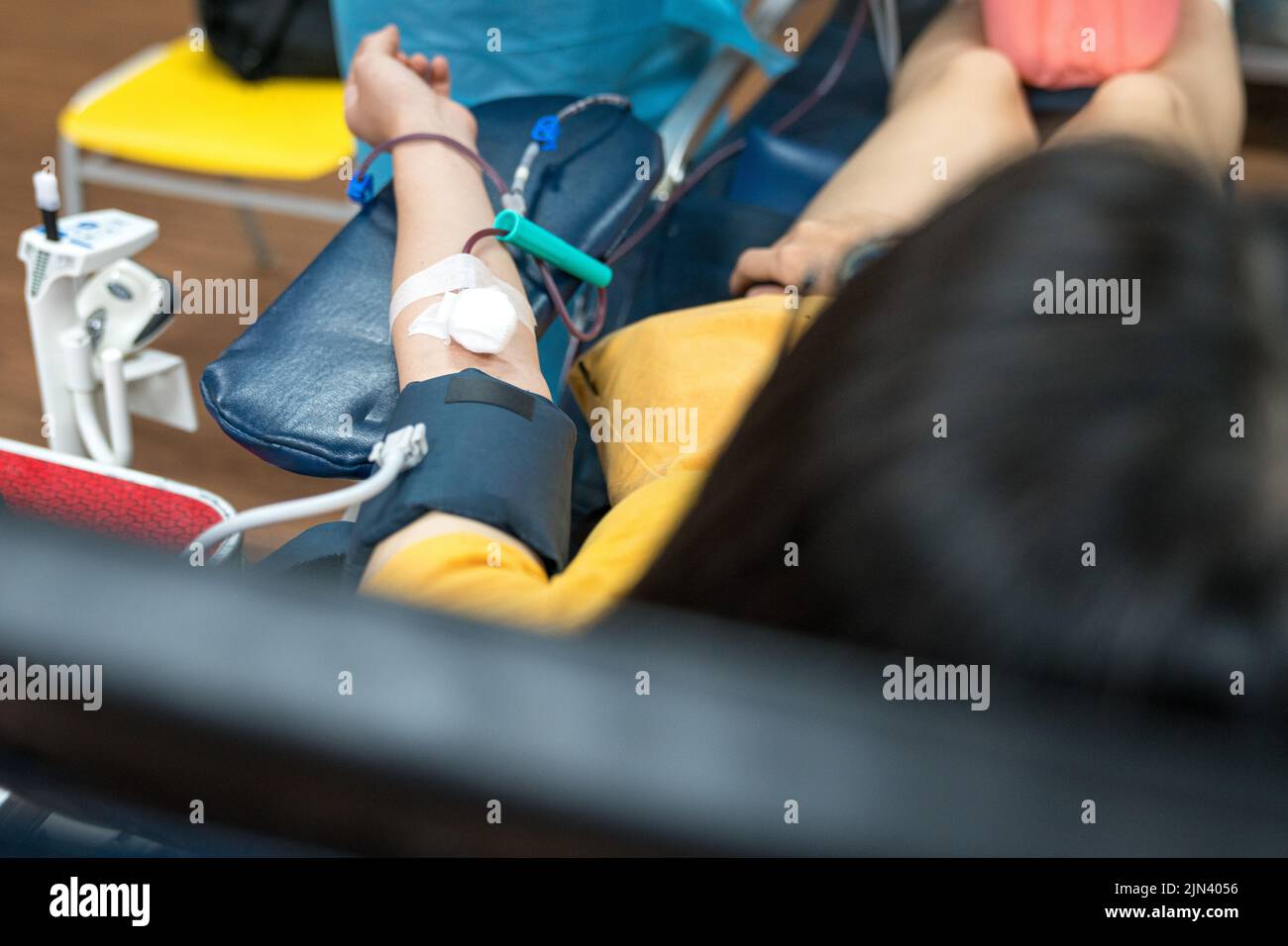 Blood donor lying on hospital bed donating blood Stock Photo Alamy