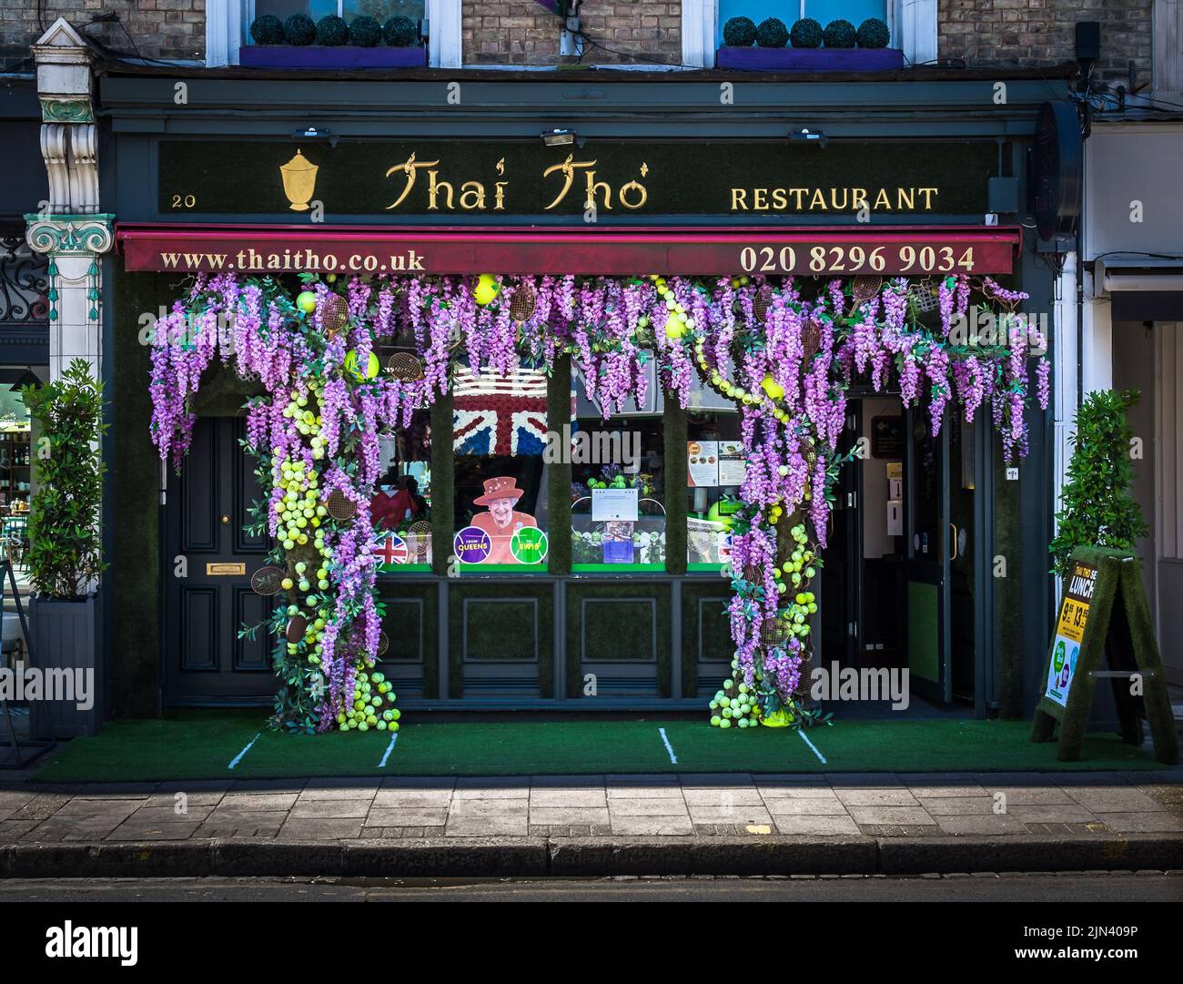 London, UK, July 2022, view of Thai Tho, a restaurant in Wimbledon Village decorated for the time of the tournament. Stock Photo