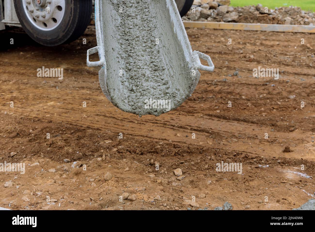 Process of pouring cement on a new driveway for a residential property