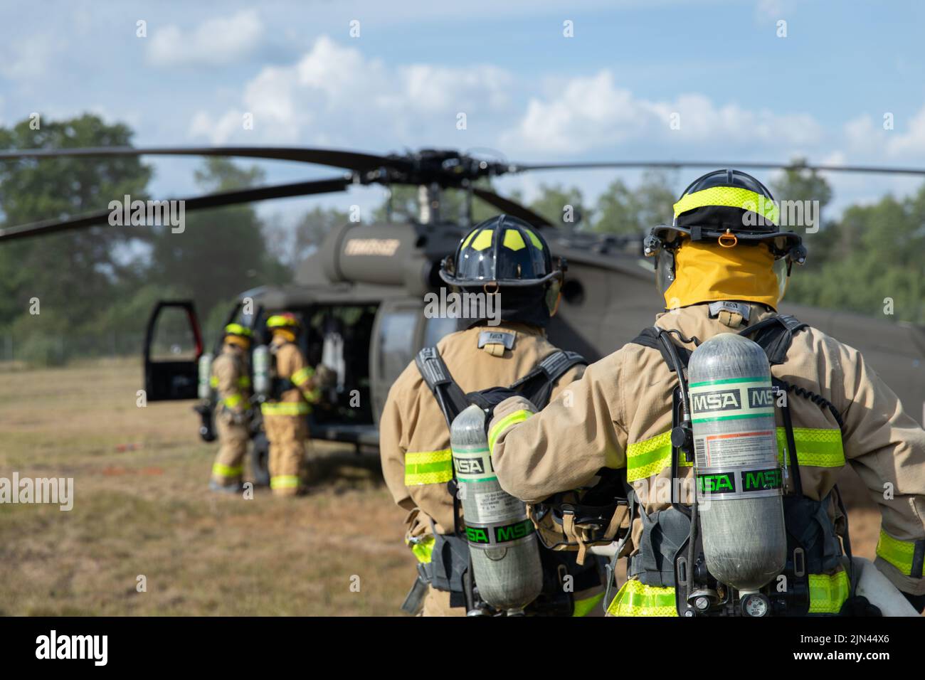 Firefighters from the Camp Grayling Fire Department conduct Pre-accident Plan Rehearsal training as part of Northern Strike 22 at Grayling Army Airfield, Grayling, Mich., Aug. 6, 2022. Northern Strike is designed to challenge 7,400 service members with multiple forms of training that advance interoperability across multicomponent, multinational and interagency partners. Stock Photo
