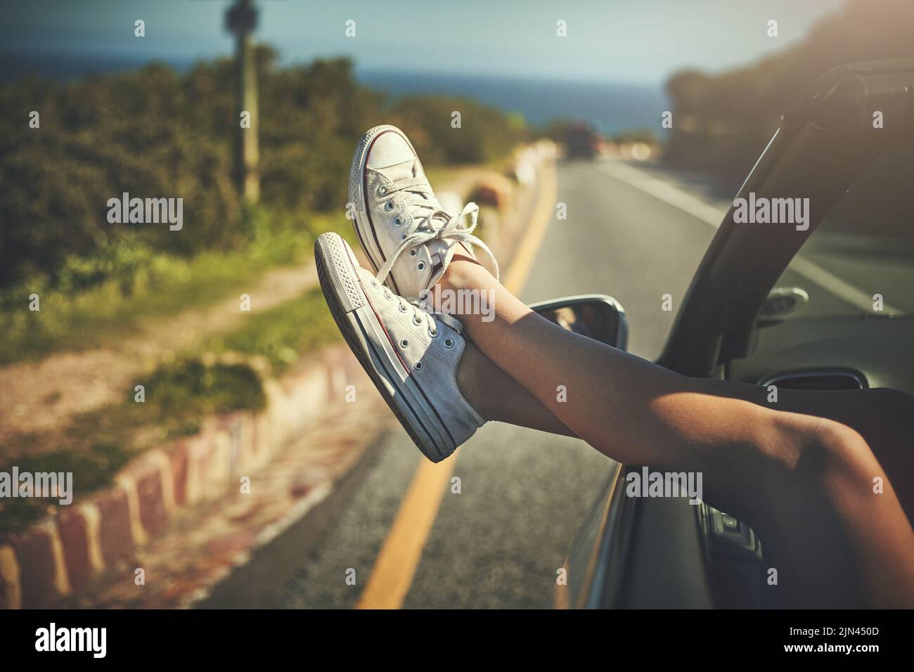 This is how I relax. an unrecognizable woman putting her feet up while