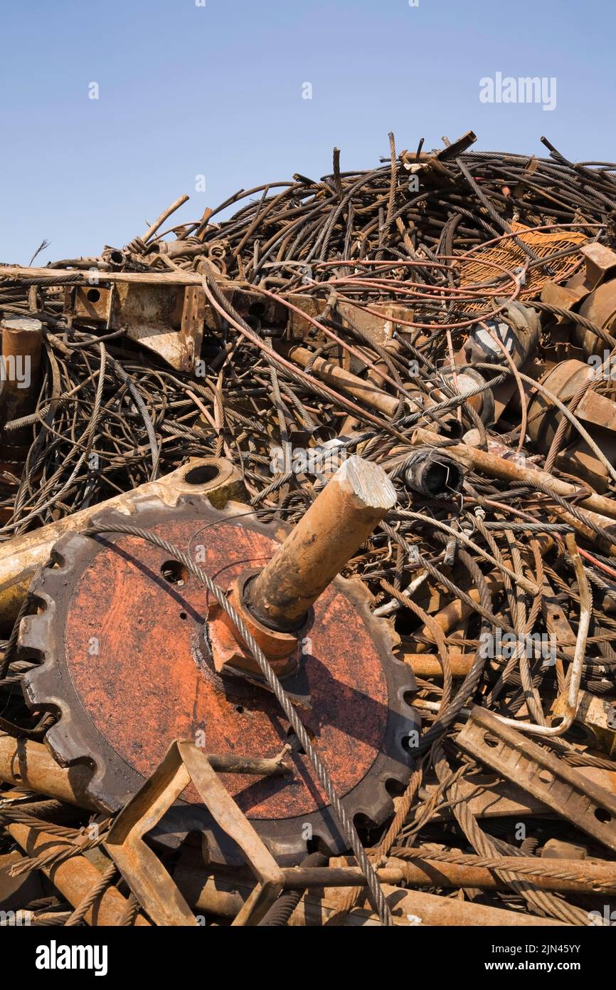 Pile of assorted rusted ferous metal parts and pieces at scrap metal recycling yard, Quebec, Canada Stock Photo
