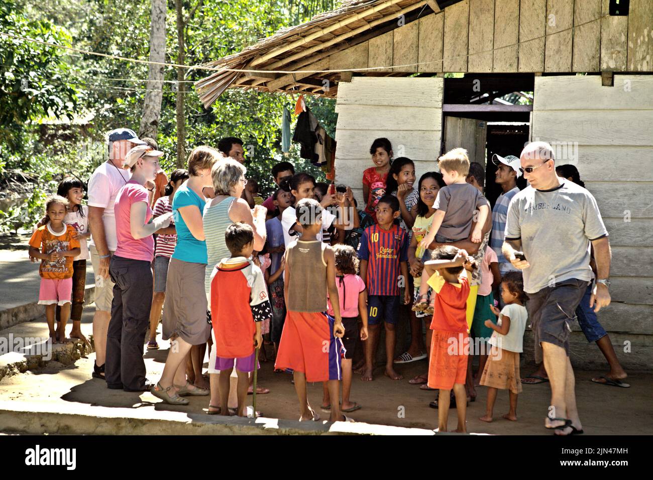 Villagers interacting with tourists in Horale village, Seram Utara Barat, Maluku Tengah, Maluku, Indonesia. Stock Photo